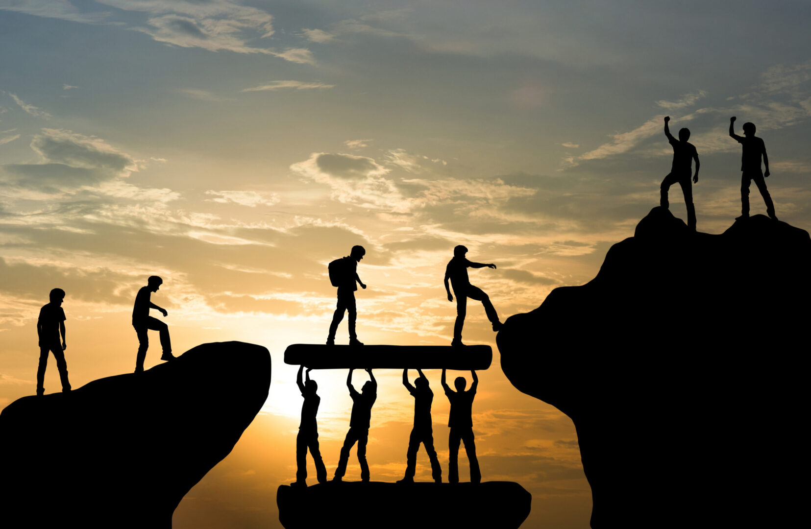 A group of people standing on top of rocks.